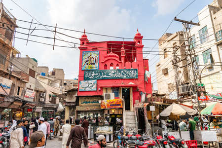 Lahore Walled City Picturesque View of a Red Colored Shrine on a Cloudy Blue Sky Dayの写真素材