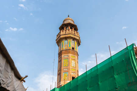 Lahore Wazir Khan Mughal Era Mosque Picturesque View of Minaret on a Sunny Blue Sky Dayの写真素材