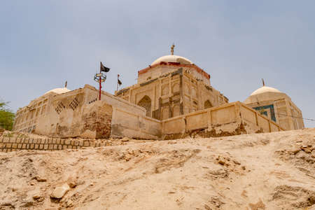 Sukkur Adam Shah Ji Takri Mausoleum Picturesque View on the Hill on a Sunny Blue Sky Dayの写真素材