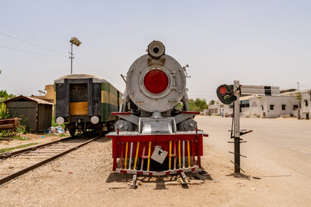 Sukkur Main Railway Station Picturesque View of an Old Retro Steam Locomotive on a Sunny Blue Sky Dayの写真素材
