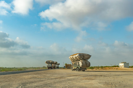 Heavily Overloaded Pakistani Trucks on the Hyderabad Karachi Highway on a Sunny Blue Sky Day