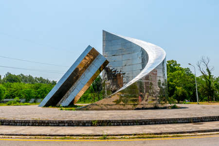 Islamabad Star and Crescent Monument Picturesque View at Pakistan China Friendship Center on a Sunny Blue Sky Dayのeditorial素材