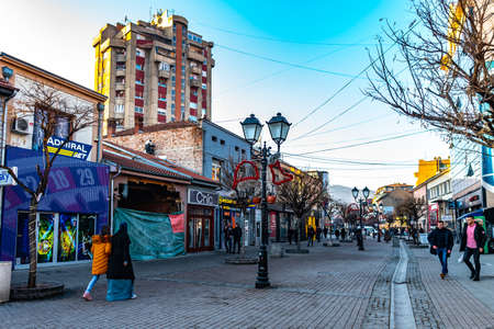 Novi Pazar 28th November Promenade Street Picturesque View with Walking Pedestrians on a Sunny Blue Sky Dayのeditorial素材