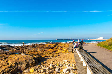 Porto Homem do Leme Beach Picturesque View with Relaxing and Sitting People on a Sunny Blue Sky Dayの写真素材