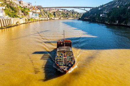 Porto Douro River Picturesque View of a Sailing Tourist Ship on a Sunny Blue Sky Day in Winter