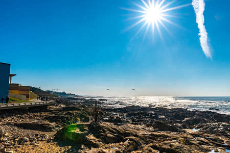 Porto Homem do Leme Beach Picturesque View with Walking People and Sun Rays on a Sunny Blue Sky Dayの写真素材