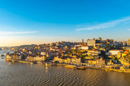 Porto Douro River Picturesque High Angle View of Ribeira District with Anchored Ships on a Sunny Blue Sky Day in Winterの写真素材
