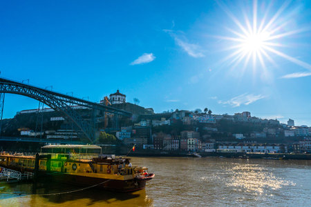 Porto Douro River Picturesque View of a Ship with Sun Rays on a Sunny Blue Sky Day in Winter