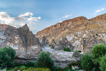 Soganli Valley Breathtaking Picturesque View of Rock-Cut Houses and Cloisters on a Blue Sky Day in Summerの写真素材
