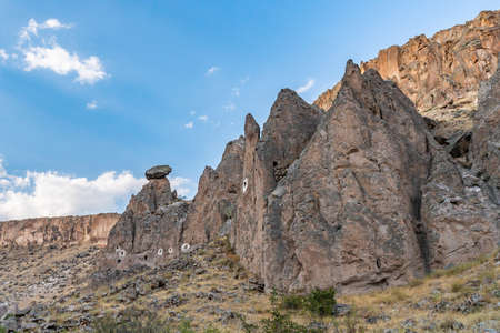 Soganli Valley Breathtaking Picturesque View of Rock-Cut Houses and Cloisters on a Blue Sky Day in Summerの写真素材
