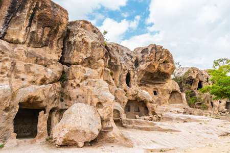 Gumusler Monastery Breathtaking Picturesque View of Rock-Cut Houses and Churches on a Blue Sky Day in Summerの写真素材