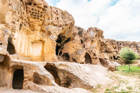 Gumusler Monastery Breathtaking Picturesque View of Rock-Cut Houses and Churches on a Blue Sky Day in Summerの写真素材