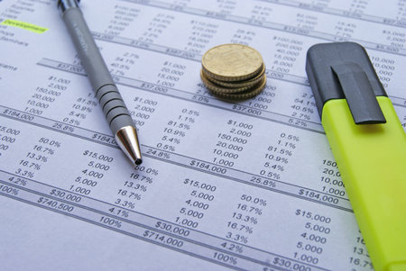 Accounts and charts with business equipmentの写真素材