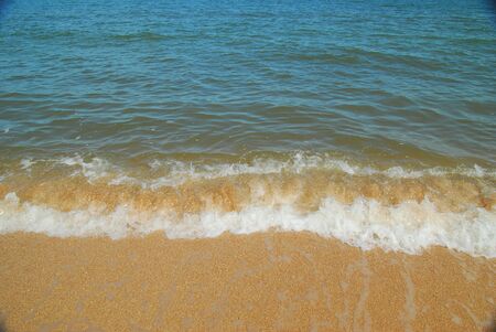 Calm sea surf at the shell sand beach. Background.の写真素材