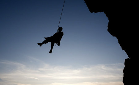 climber hanging on rope  の写真素材