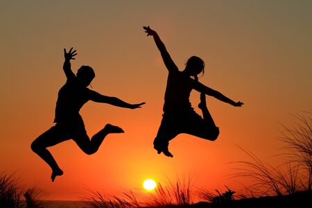 sunset girls jumpingの写真素材