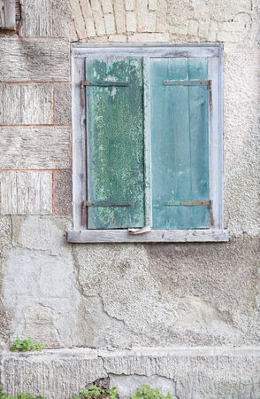old green window shuttersの写真素材