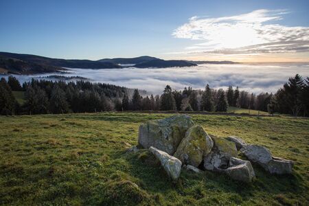 rocks and inversion fog in black forest valley, Germanyの写真素材