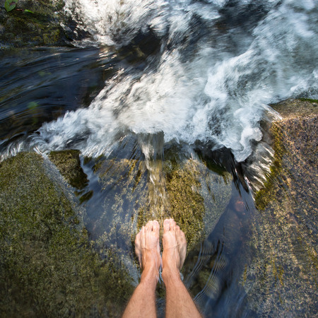 feet in waterfallの写真素材