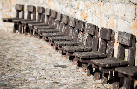 old wooden chairs on wallの写真素材