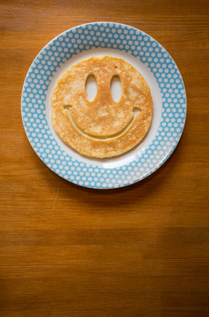 smiling pancake on plateの写真素材