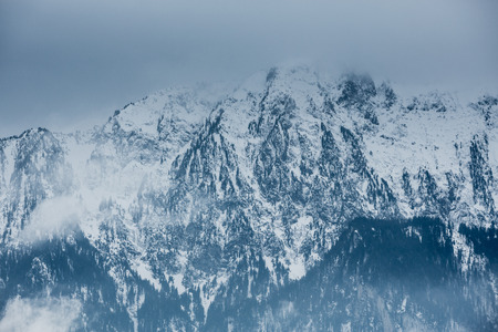 dark clouds in swiss alps in winterの写真素材