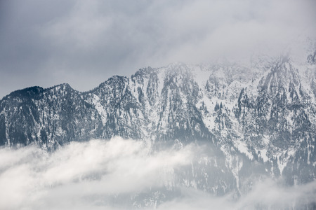dark clouds in swiss alps in winterの写真素材