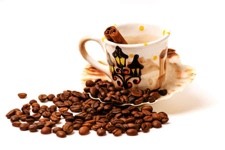 Grain coffee and a cup on a white backgroundの写真素材
