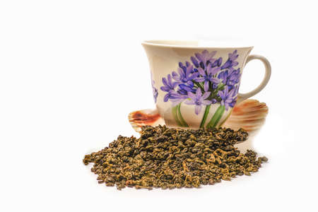 Green tea scattered on whiteの写真素材