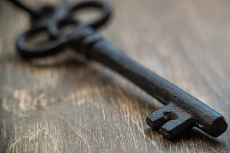 Old key on a wooden backgroundの写真素材