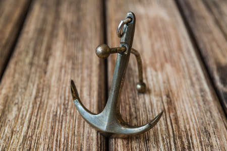 Anchor on a wooden backgroundの写真素材