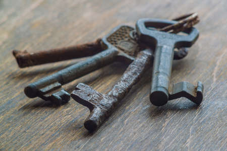Old key on a wooden backgroundの写真素材