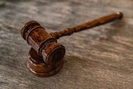 Hammer of a judge on a wooden backgroundの写真素材