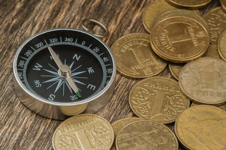 Coins on an old wooden backgroundの写真素材