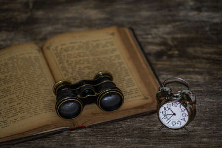 clock on a wooden backgroundの写真素材