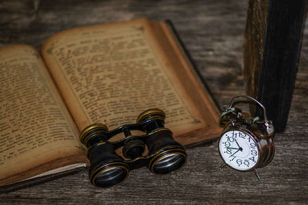 clock on a wooden backgroundの写真素材