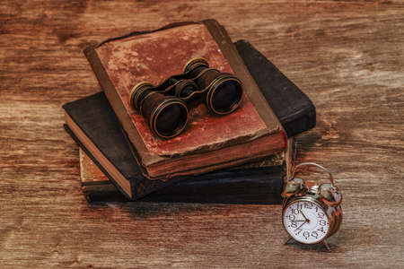 clock on a wooden backgroundの写真素材