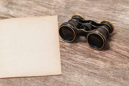 Old paper and binocularsの写真素材
