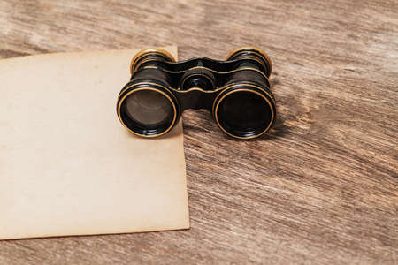 Old paper and binocularsの写真素材