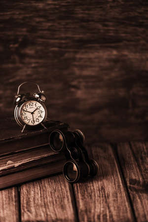 An old book of binoculars against the background of an old treeの写真素材