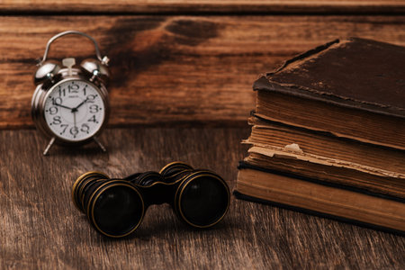 An old book of binoculars against the background of an old tree