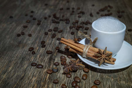 coffee grains on old wooden backgroundの写真素材