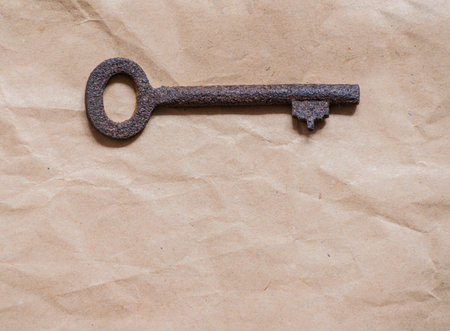 old key on paper backgroundの写真素材