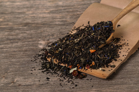 loose leaf tea in a wooden spoonの写真素材