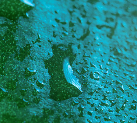Drops of dew on a green leaf, macro, can be used as a background, screen saver, postcard for...