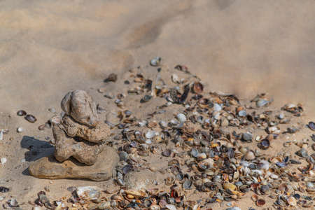 Zen concept. Object made of stone on the beach. Stone pyramid for meditation. Harmony and Meditation. Zen stones.の写真素材