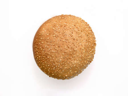 Fresh fragrant bun for burgers with sesame seeds on a white background. Can be used for advertisingの写真素材