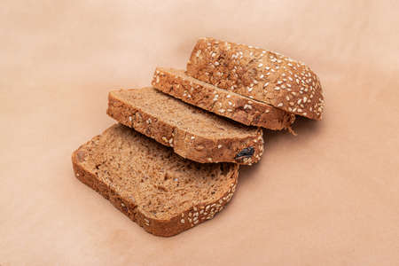 Sliced ââbread on an old paper background. Slices of bread. Side viewの写真素材