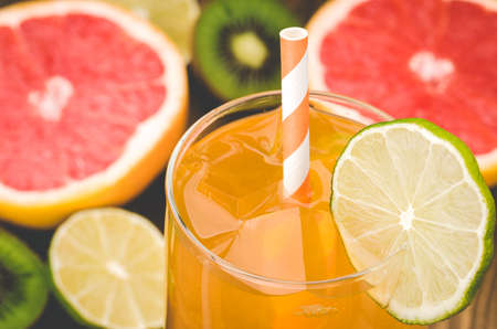 cocktail with lemon against the background of fruit / cocktail against the background of fruitの写真素材