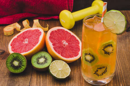 fitness background with abundance of fruit and cocktail / concept of healthy food with accessories for fitness, close upの写真素材